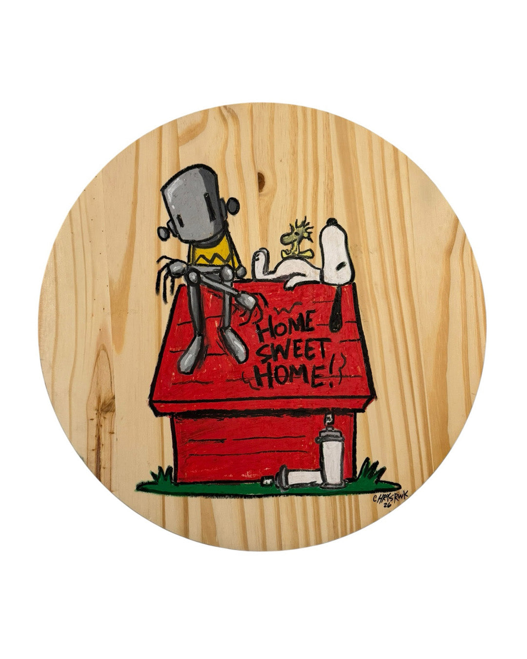 Wooden coaster with a cartoon design of a doghouse, character, and 'Home Sweet Home' text on a white background.