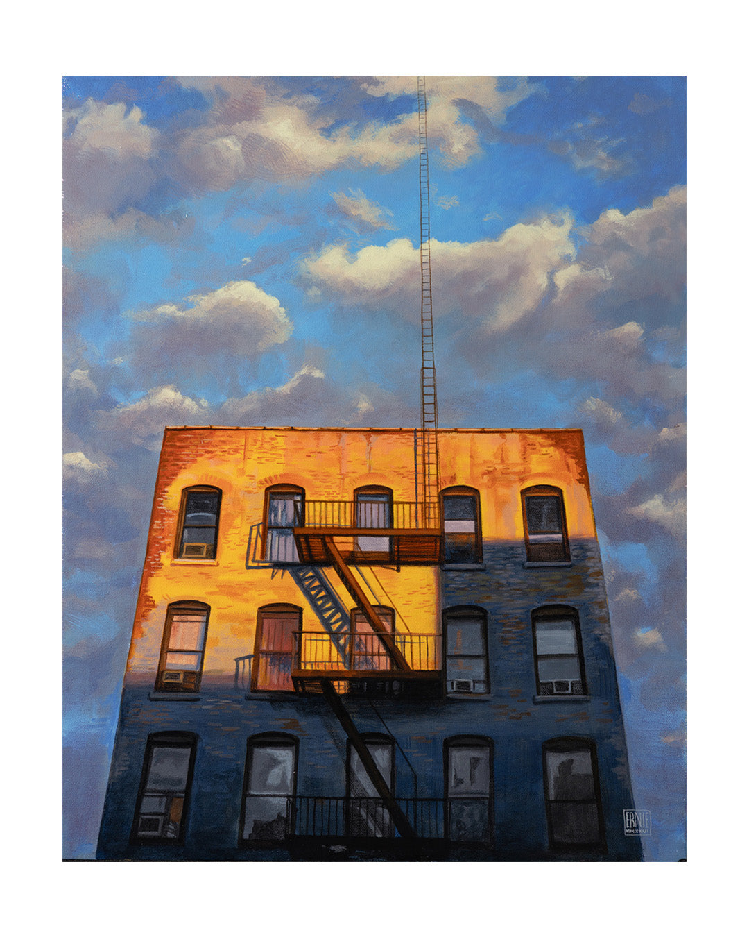 Building with a fire escape against a blue sky with clouds