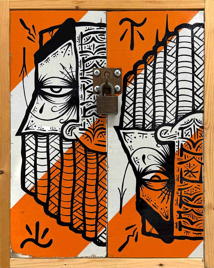 mixed media piece using repurposed road block with black enamel drawings by artist GATS