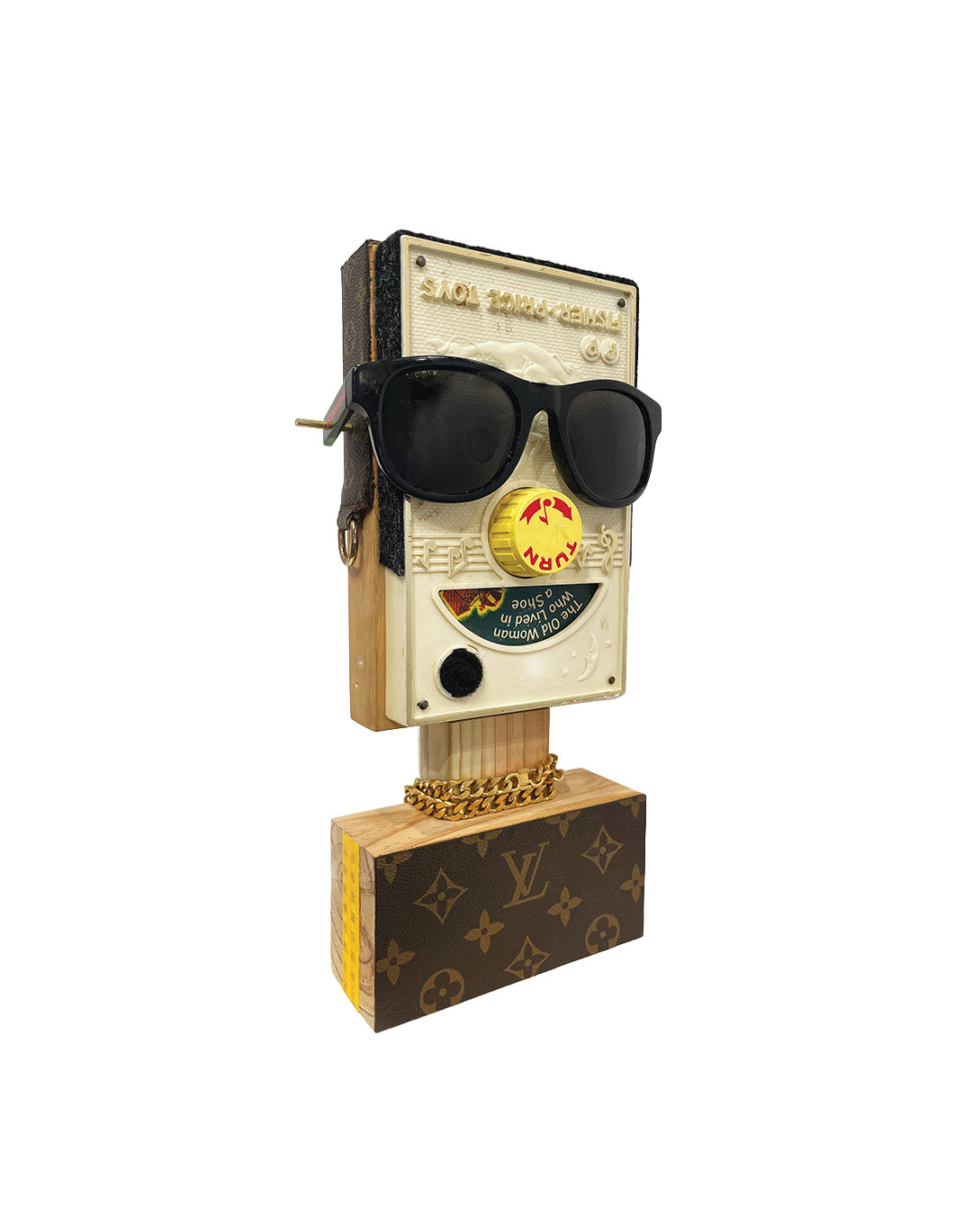 Sculpture of a face made from vintage toys