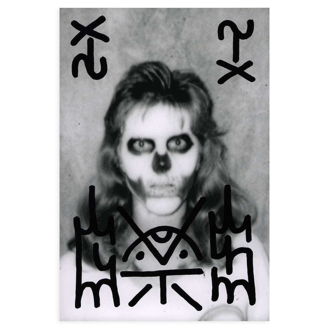 hand painted black and white found photo by GATS depicting a person with skull face paint