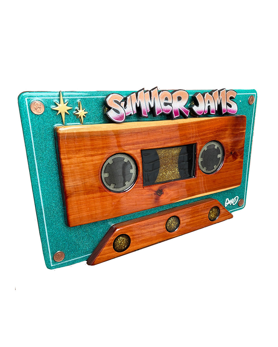 Wooden cassette tape sculpture with 'Summer Jams' text on a teal background